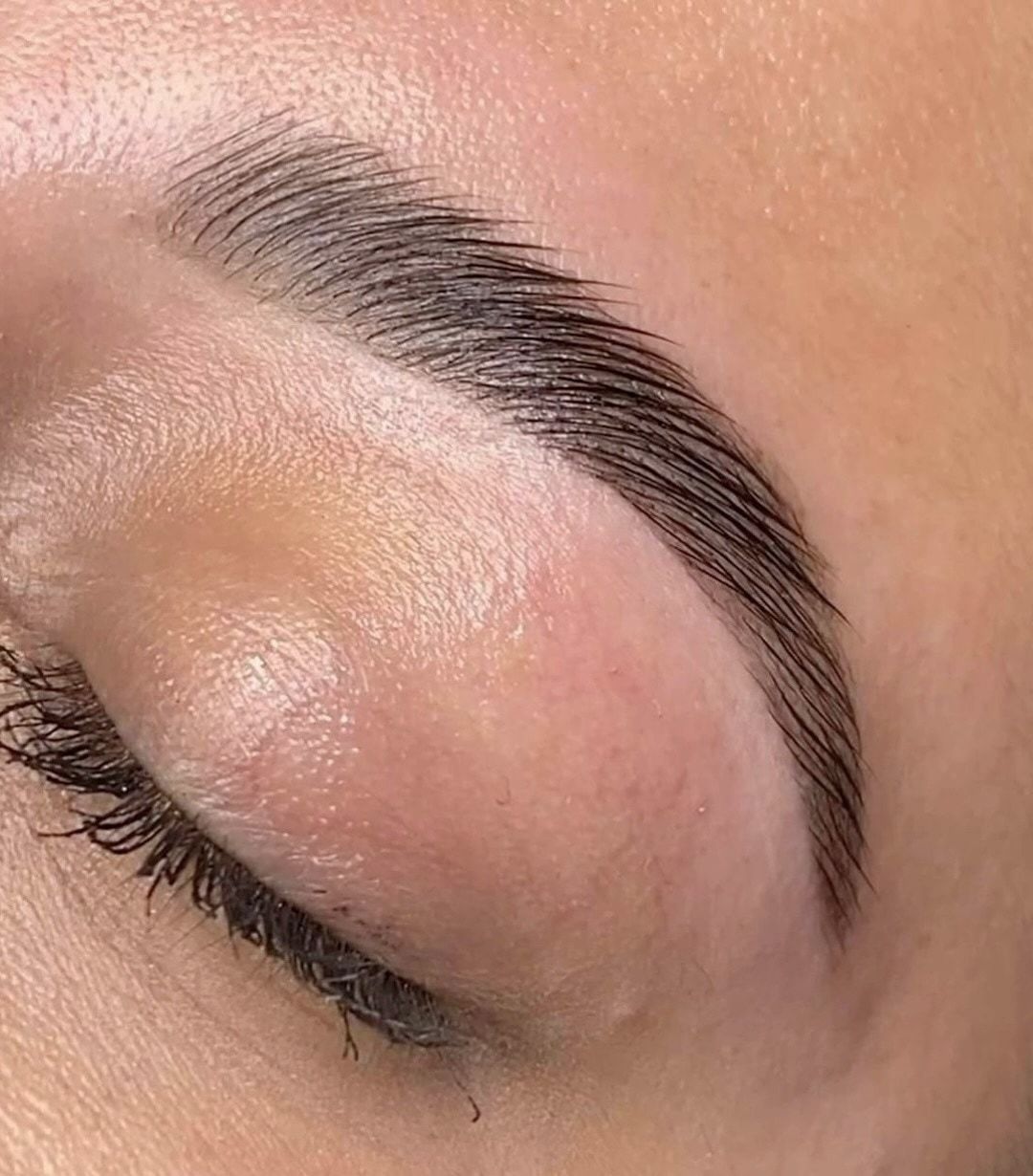 A brow after a sculpt and tint, the eye closed
