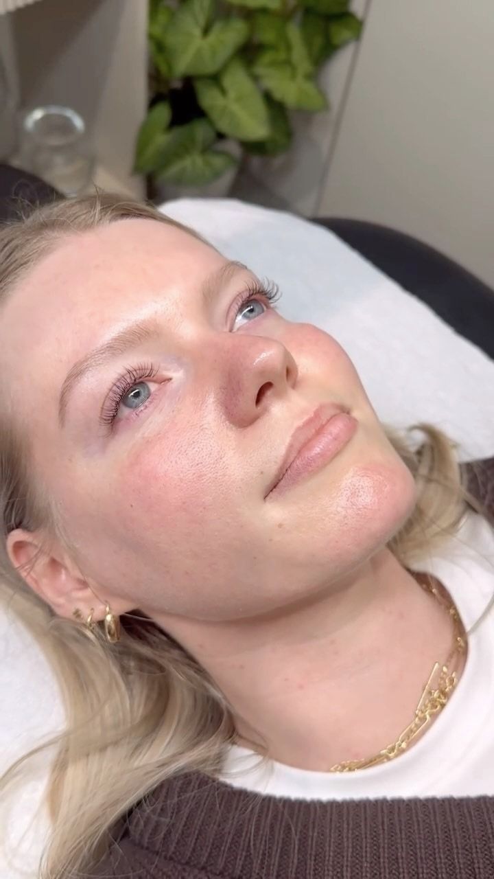 A client lying back after lash extensions